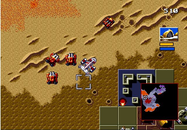 На скриншоте видны все типы поверхностей в Dune II. Красная пыль — это спайс, светлая область — песок, часть её покрыта дюнами. На тёмной области можно строить базу. В правом нижнем углу — горы.